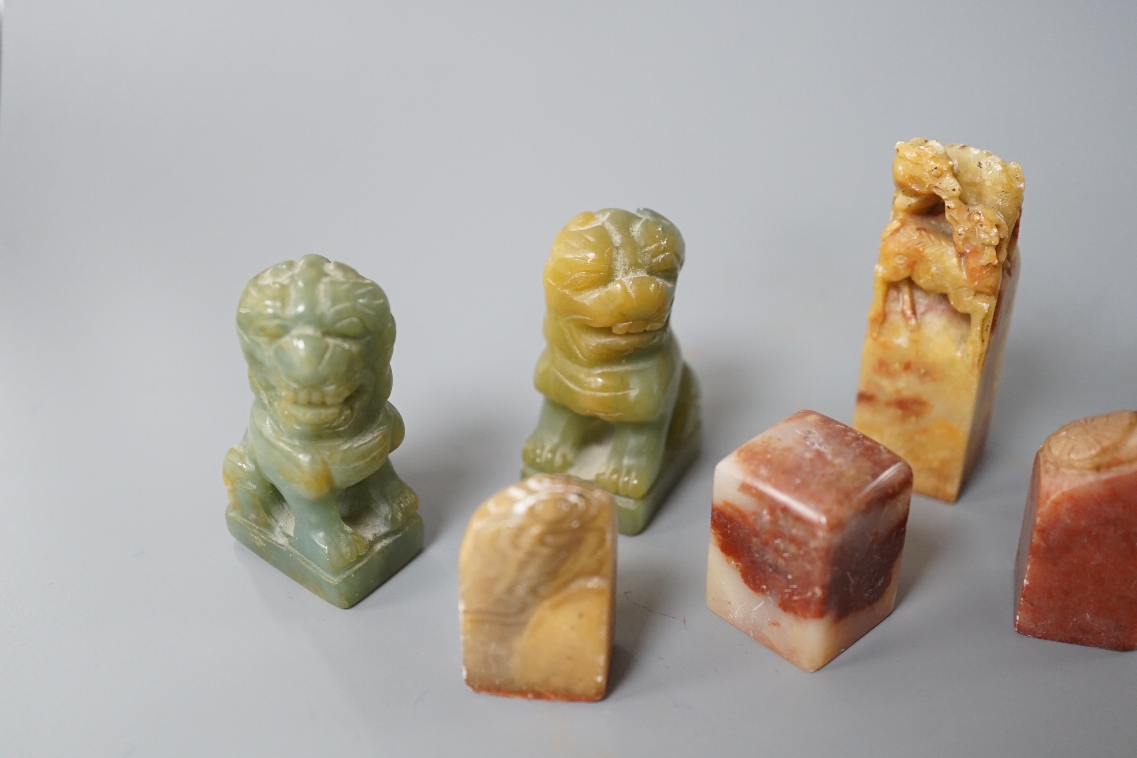 A selection of five Chinese mixed stone seals together with a pair of small jadeite dog figures (7), largest 5.5cm